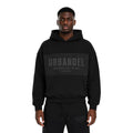 URBANDEL Midnight Crest Hoodie in Black featuring premium 400 GSM heavyweight fleece, oversized fit, tonal raised chest and back logos, and signature Earned. Not Given. Since 2008. branding.