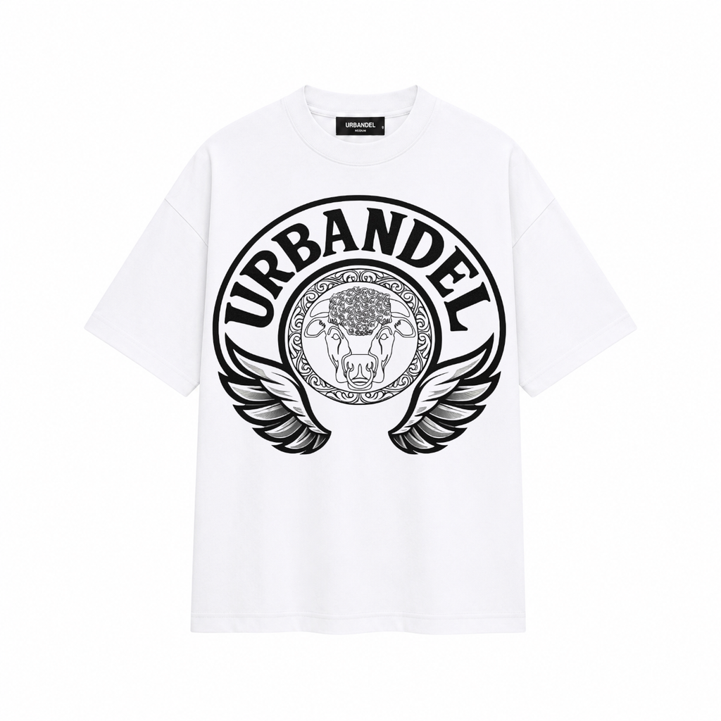 A white short-sleeve crewneck t-shirt featuring a large black circular graphic on the front with the word 'URBANDEL' and a winged Medusa-style emblem.