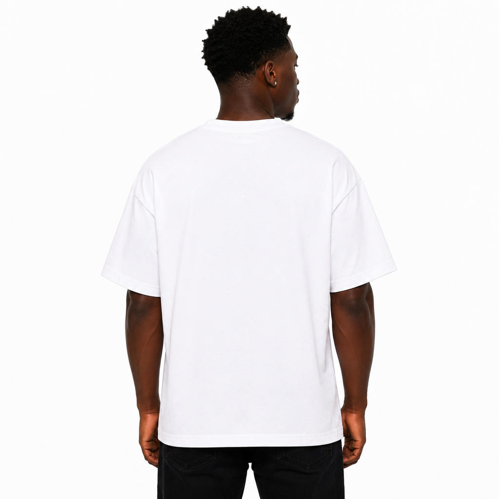 A man viewed from behind wearing a plain white short-sleeve t-shirt and black pants, standing against a solid white studio background.